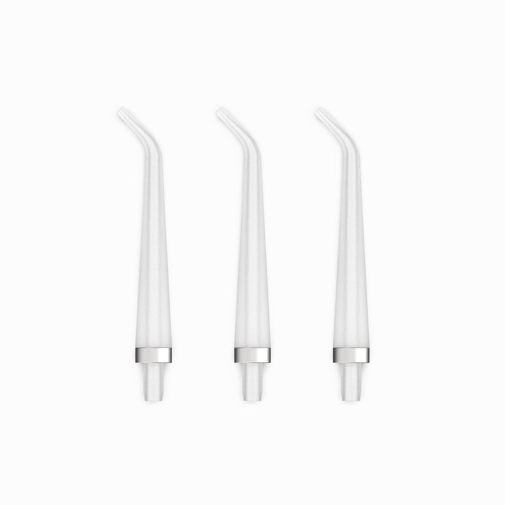 Three white straw-like objects on a white background