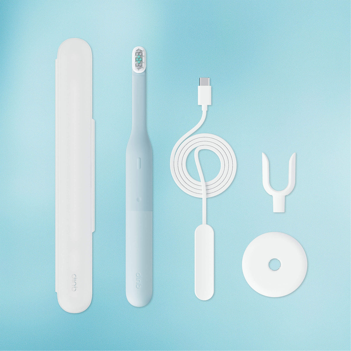 Set of dental care products including a toothbrush, charger, and cleaning tools on a light blue background.