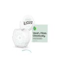 A clear plastic roll of floss with mint green thread, shown next to its light green packaging box and a matching floss roll cap on a white background.