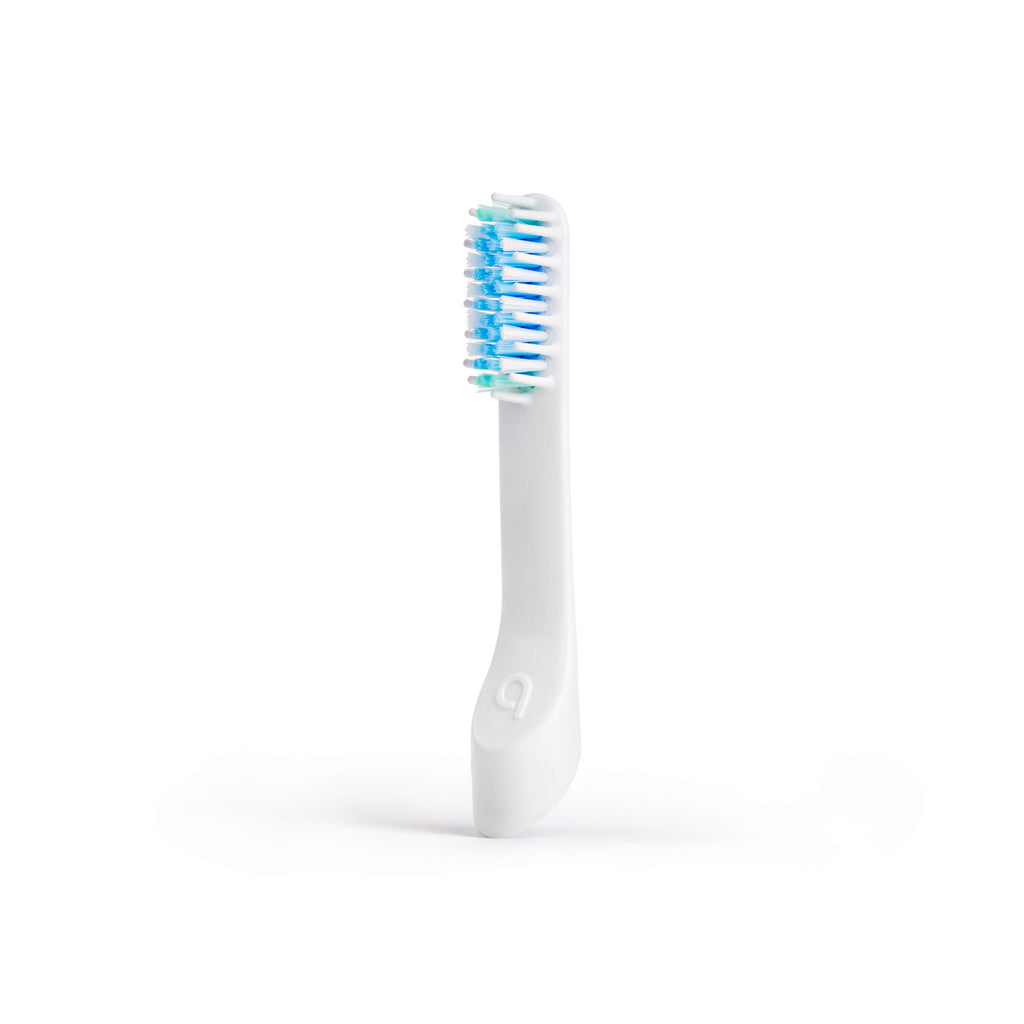 White electric toothbrush with blue bristles on a white background